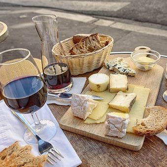 french cheese and wine tasting outside on a table in paris