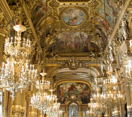 opera garnier the splendid grand hall with lit up chandeliers